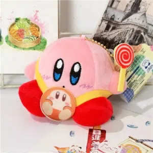 Różowy pluszowy Kirby, siedzący z laską cukrową