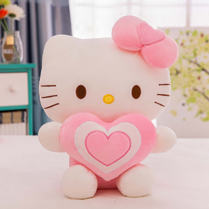 Hello Kitty pluszak z sercem siedzący na stole